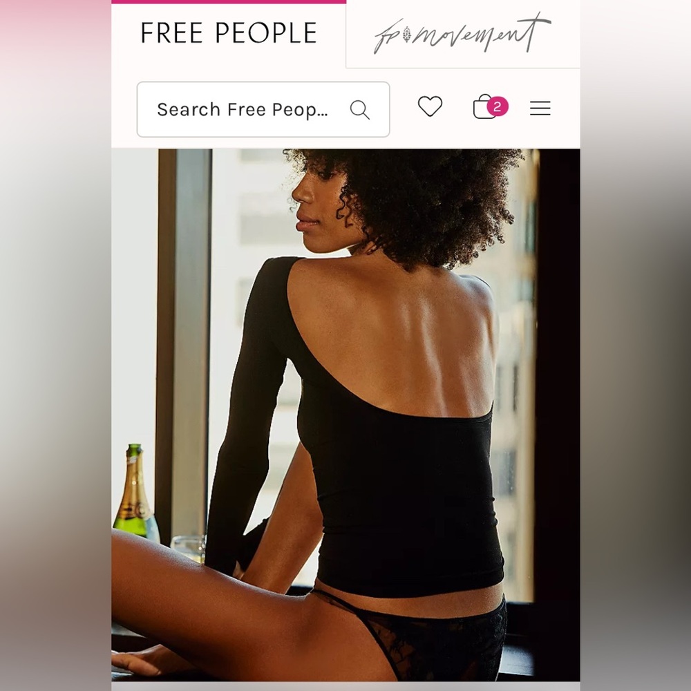 Free People size M/L Low back seamless long sleeve black top.